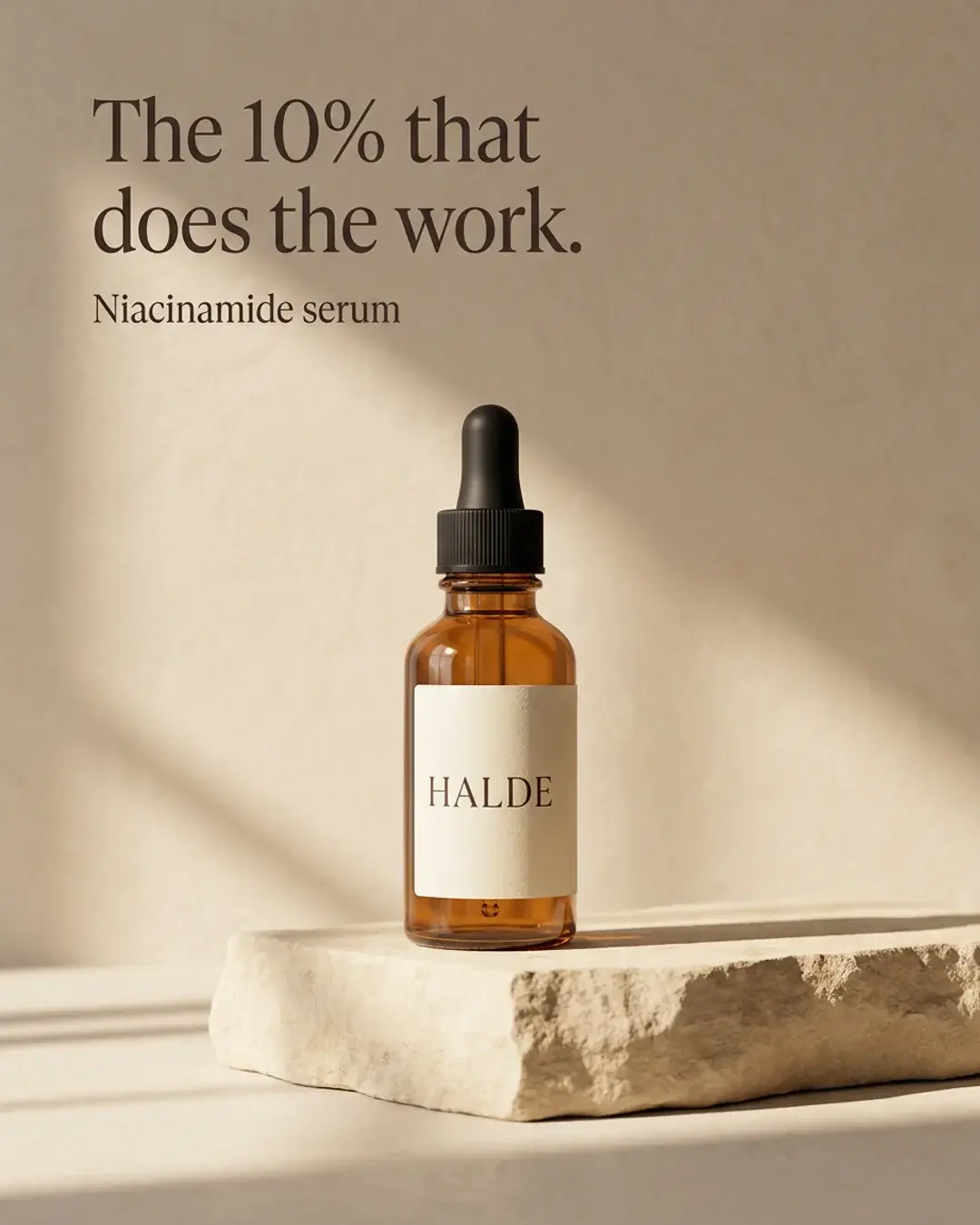 Static ad for Halde serum: an amber dropper bottle on a sand plinth in window light, headline “The 10% that does the work.”