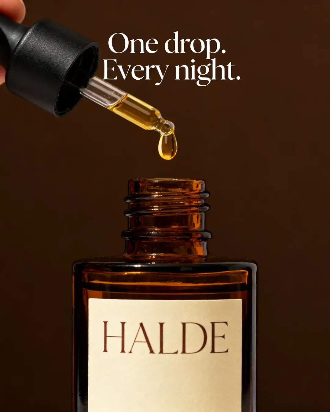 Halde concept: a single drop on the dropper above the amber bottle, headline “One drop. Every night.”